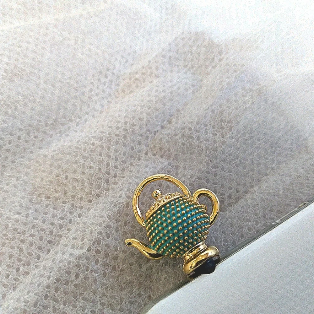 Tea pot cellphone dust plug